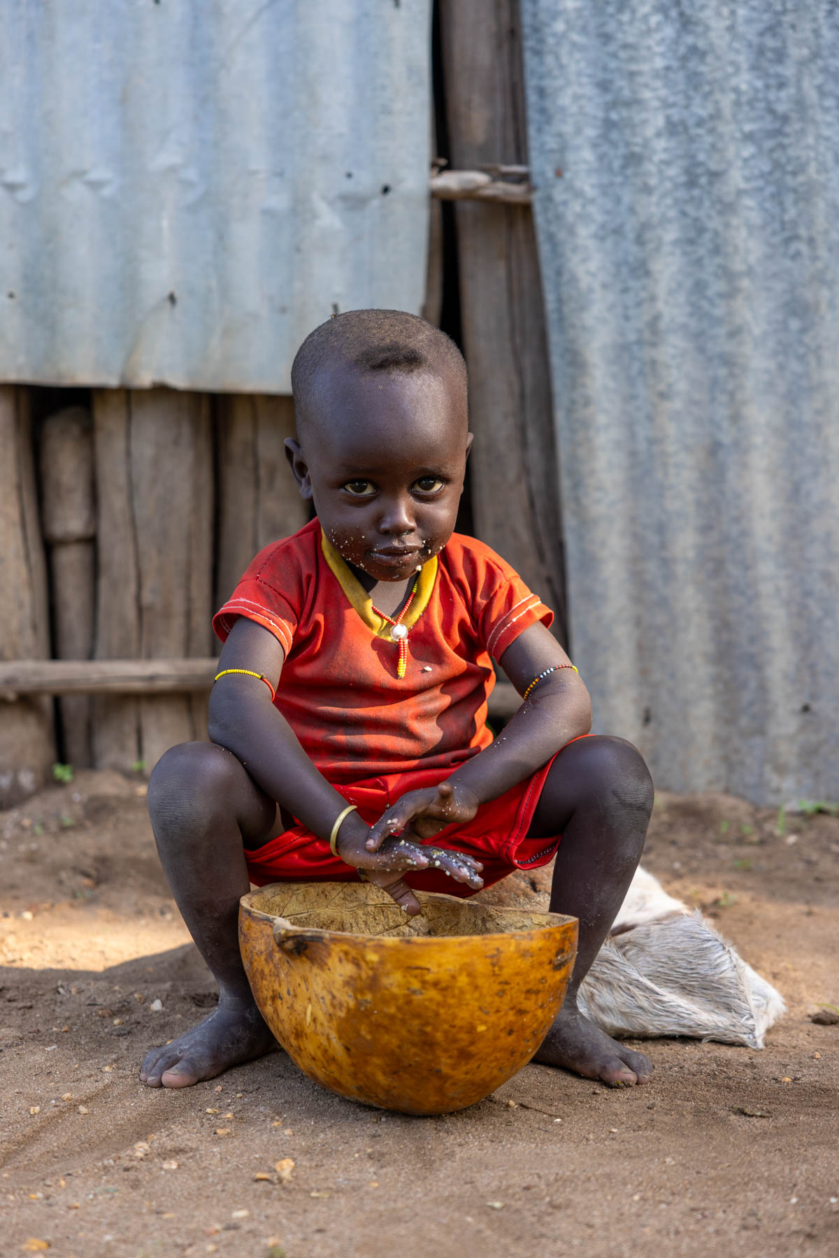 A young Kara boy eating his breakfast. (image by Ingrid Koedood)