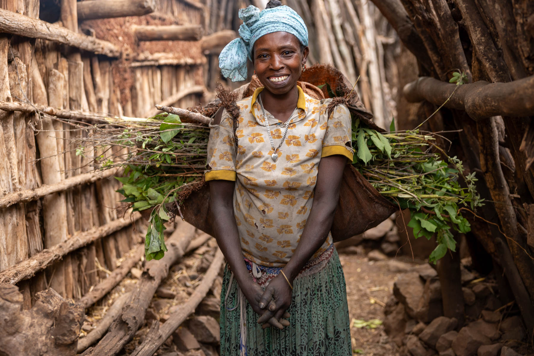 With a big smile, even while carrying the weight of the day – Konso. (image by Ingrid Koedood)