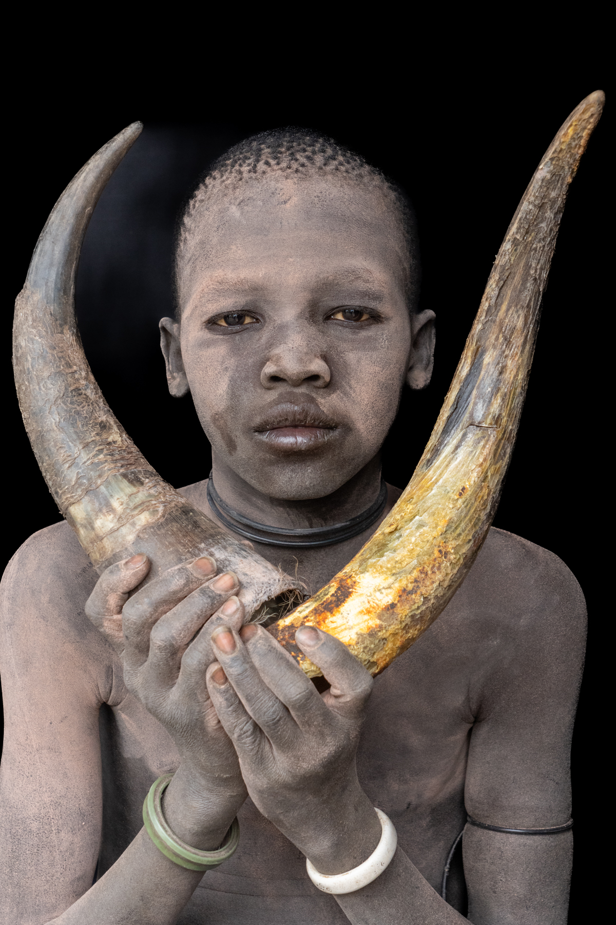Young Mundari boy with cow horns (image by Inger Vandyke)