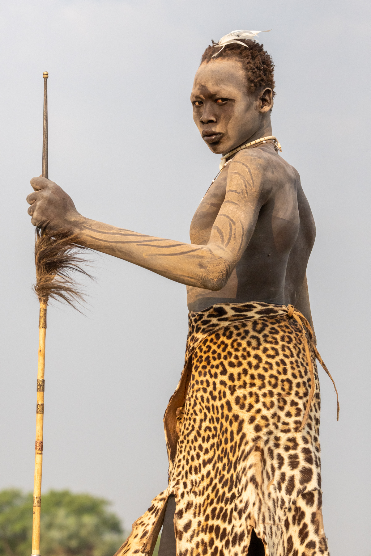 Mundari man with leopard skin and spear (image by Inger Vandyke)