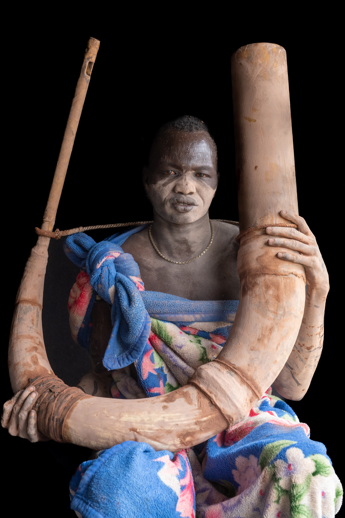 Mundari man with Tung horn (image by Inger Vandyke)