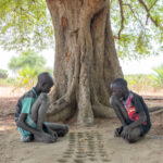 Mundari children playing games (image by Inger Vandyke)