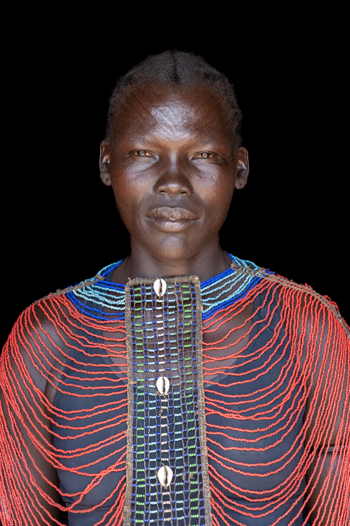 Mundari women wearing beaded collar (image by Inger Vandyke)