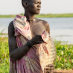 A Mundari fisherman with his Tilapia (image by Inger Vandyke)