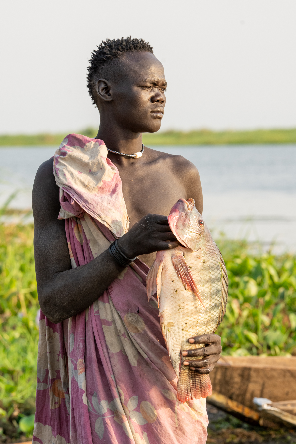 A Mundari fisherman with his Tilapia (image by Inger Vandyke)