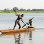 Mundari fishermen in their dugout canoe (image by Inger Vandyke)