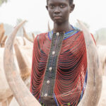 Beautiful Nyanda wearing a beaded collar in the cattle camp (image by Inger Vandyke)