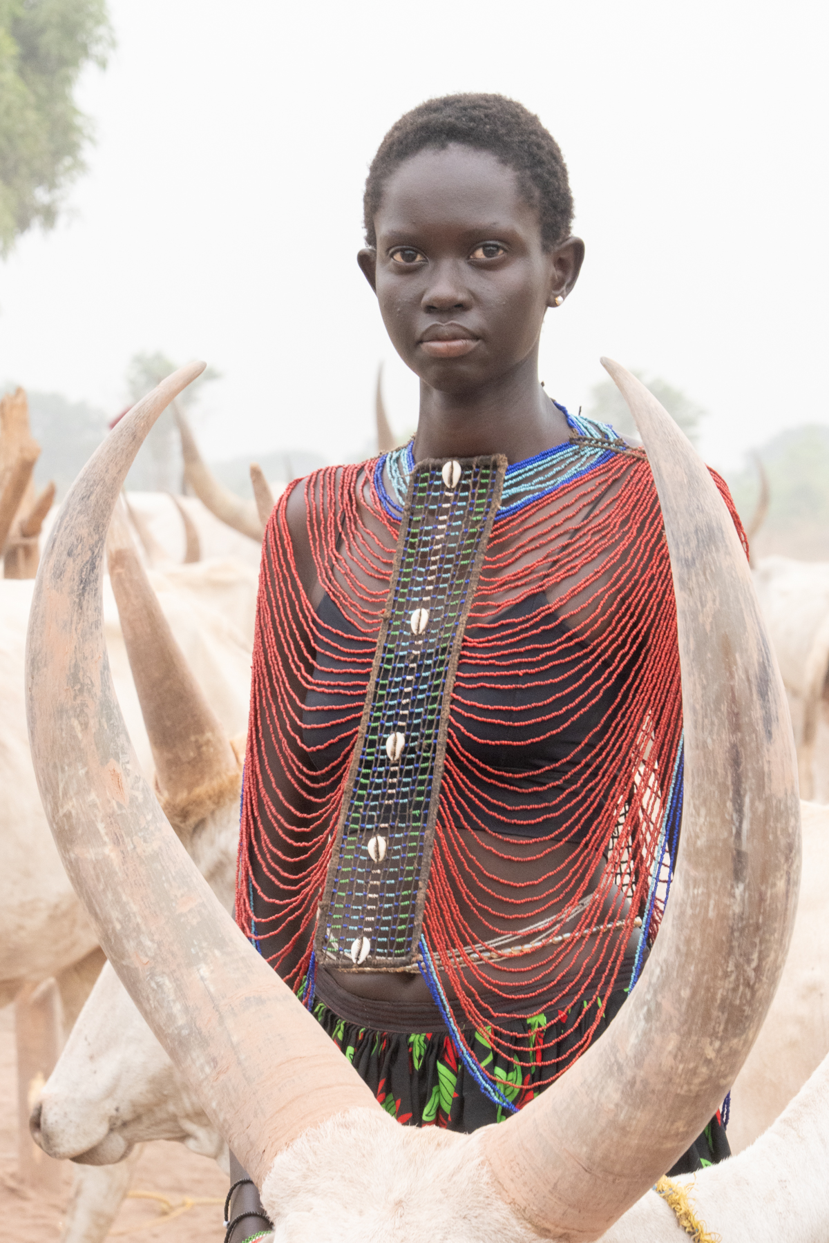 Beautiful Nyanda wearing a beaded collar in the cattle camp (image by Inger Vandyke)