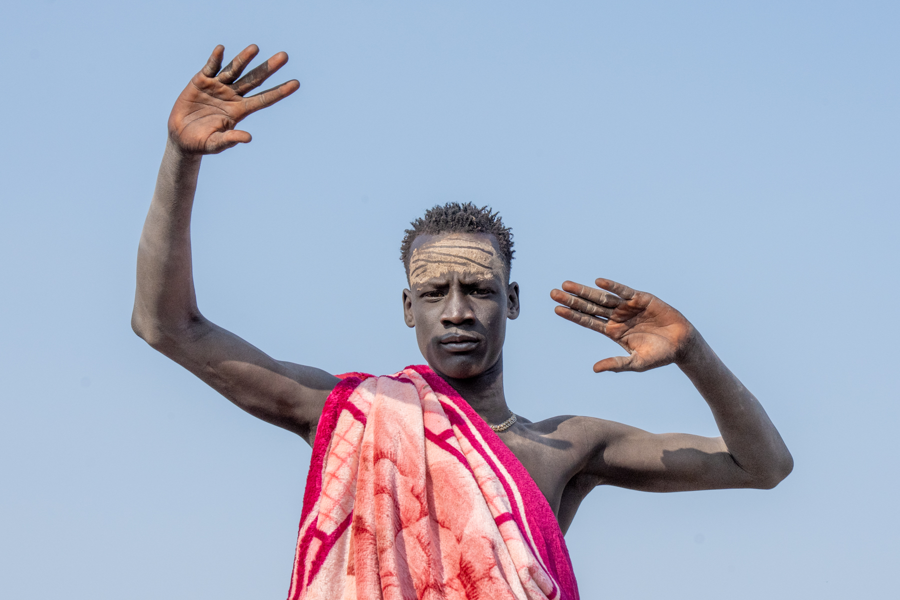 Young Mundari man dressed up for a wrestling match (image by Inger Vandyke)