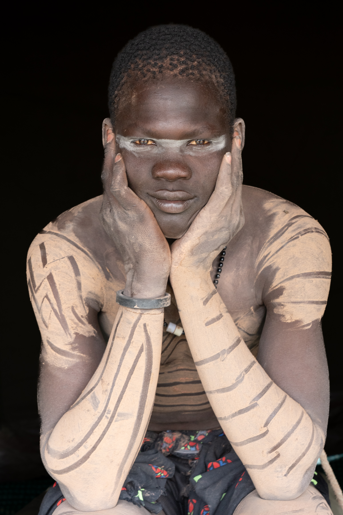 Mundari man with clay decoration (image by Inger Vandyke)