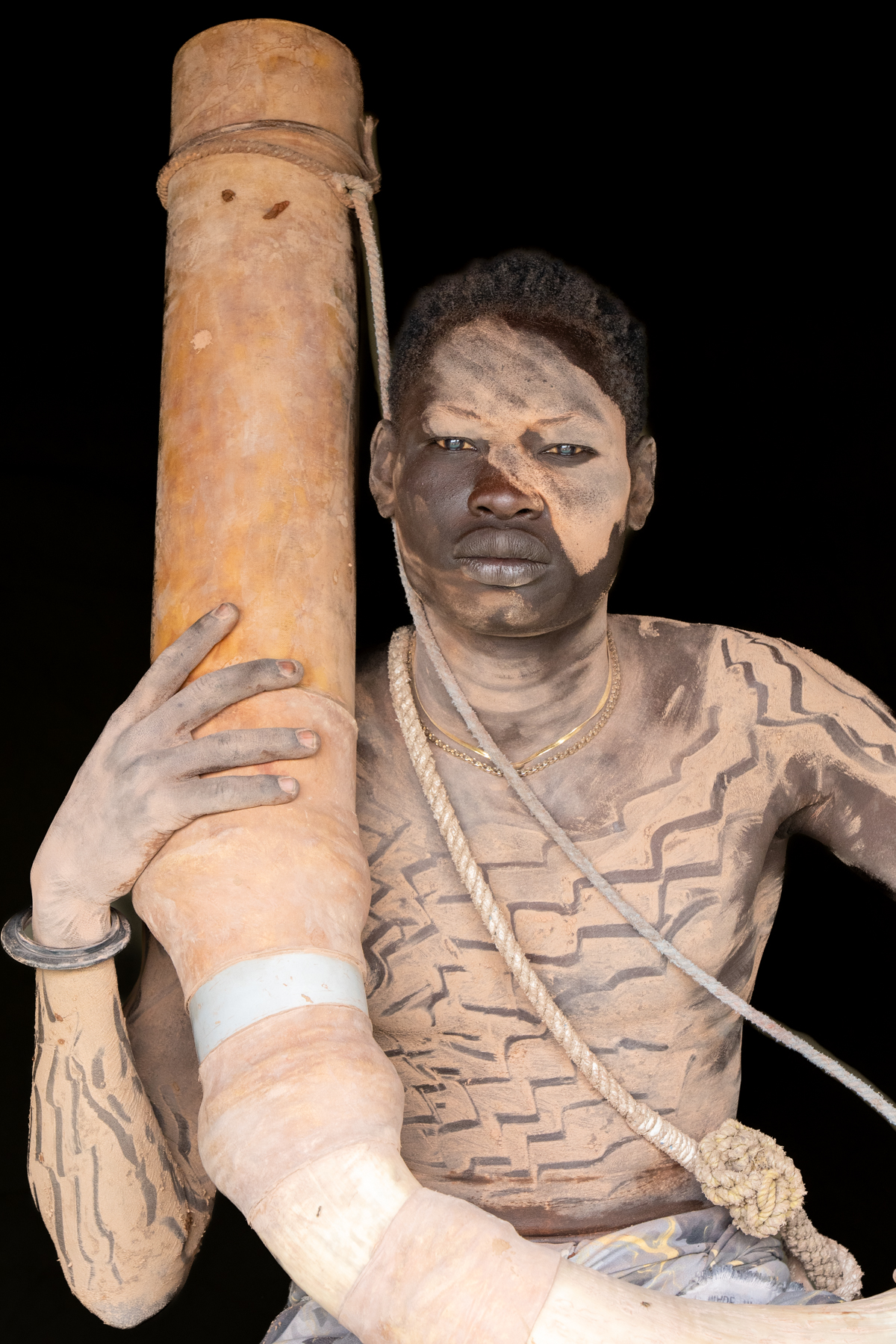 Mundari man with Tung (horn) (image by Inger Vandyke)