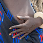 Mundari scarification and bone bracelet (image by Inger Vandyke)