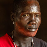 Beautiful Mundari woman with her traditional scarification and ochre (image by Inger Vandyke)