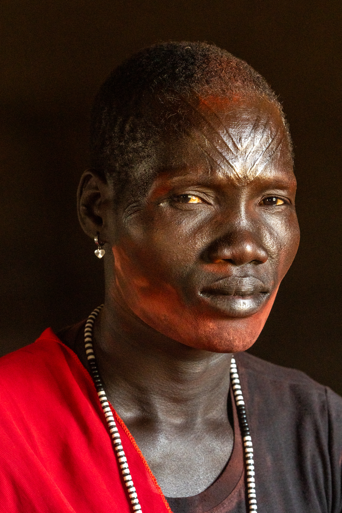 Beautiful Mundari woman with her traditional scarification and ochre (image by Inger Vandyke)