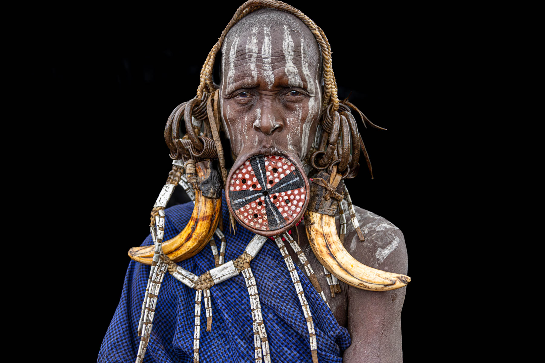 Portrait of a Mursi woman wearing a traditional lip plate. The plate is gradually stretched over time and holds deep cultural significance within the community. (image by Ingrid Koedood)