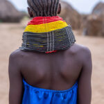 A Nyangatom woman adorned with layered neck beads. (image by Ingrid Koedood)