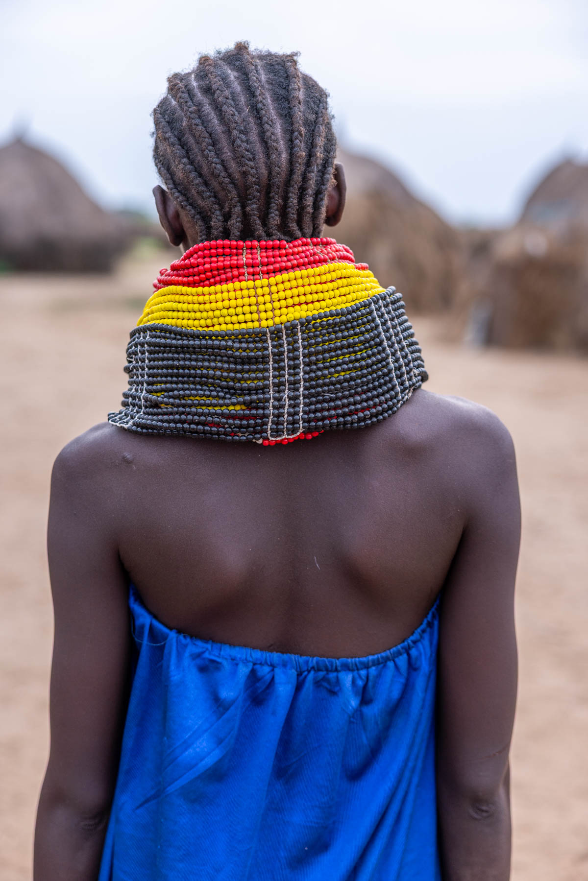 A Nyangatom woman adorned with layered neck beads. (image by Ingrid Koedood)