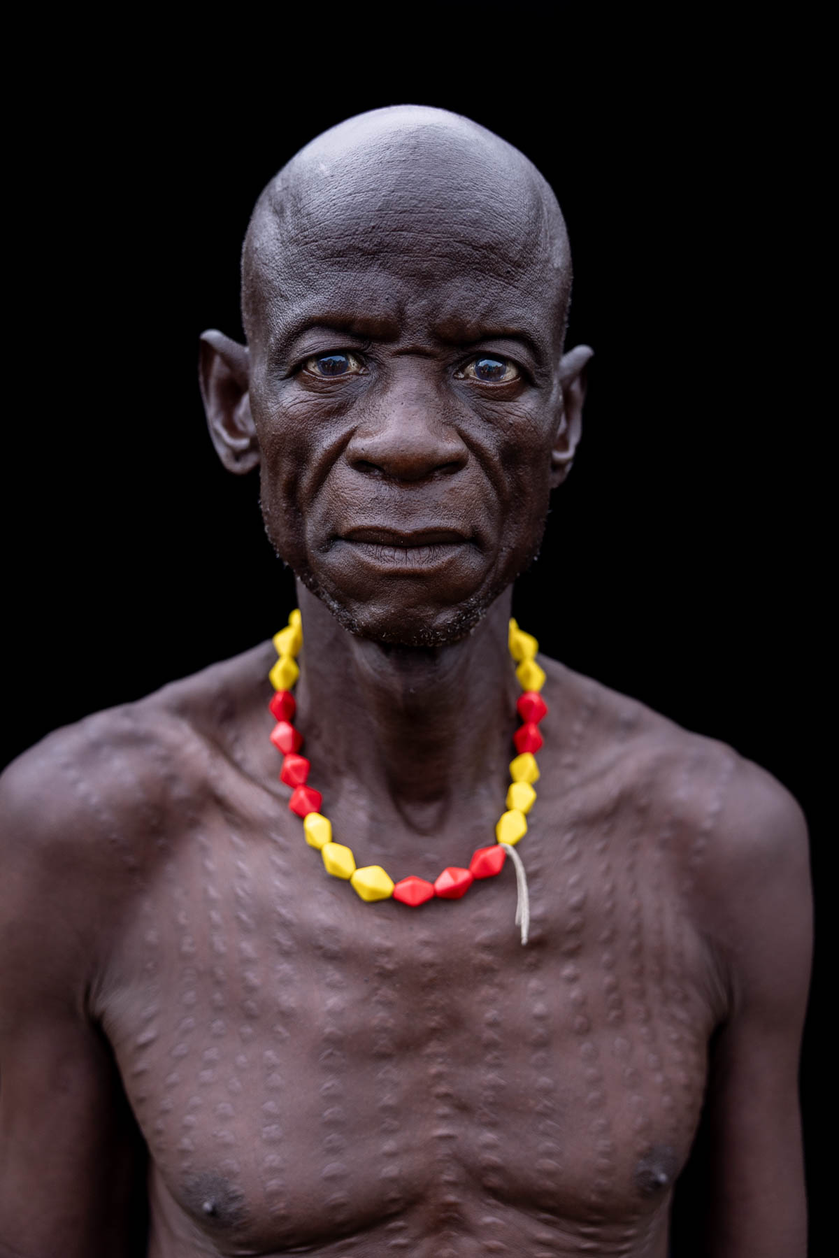 Portrait of a Nyangatom man with scarification on his chest. (image by Ingrid Koedood)