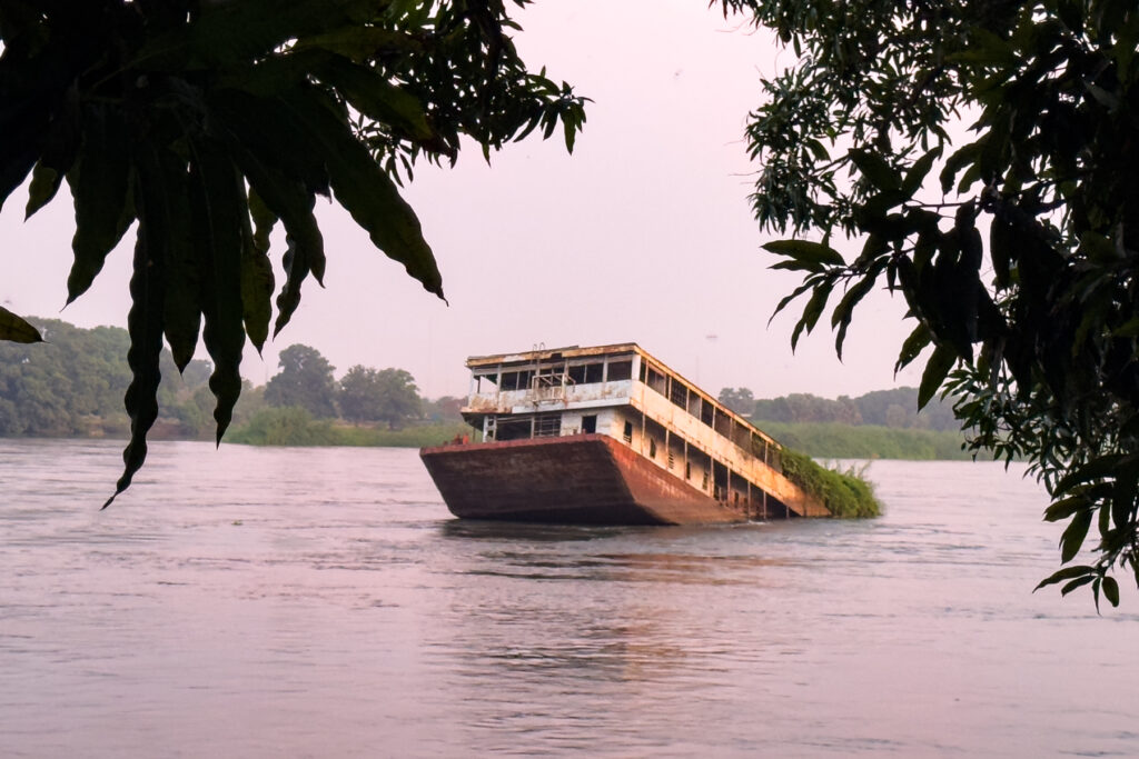 Sunken passenger ferry in the White Nile at dusk (image by Inger Vandyke)