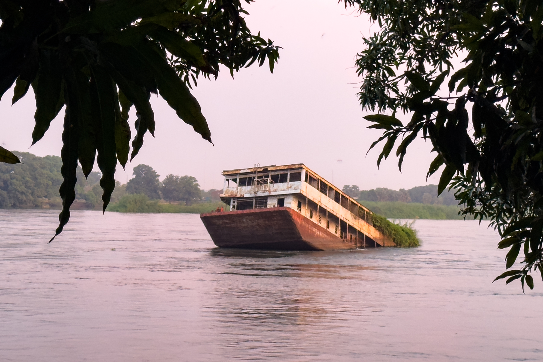 Sunken passenger ferry in the White Nile at dusk (image by Inger Vandyke)