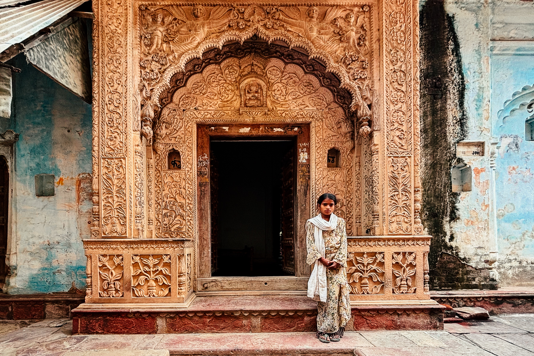 This local girl was delighted to pose for our group, backdropped by one of the crumbling former mansions in the heritage village of Uttar Pradesh (image by Virginia Wilde)