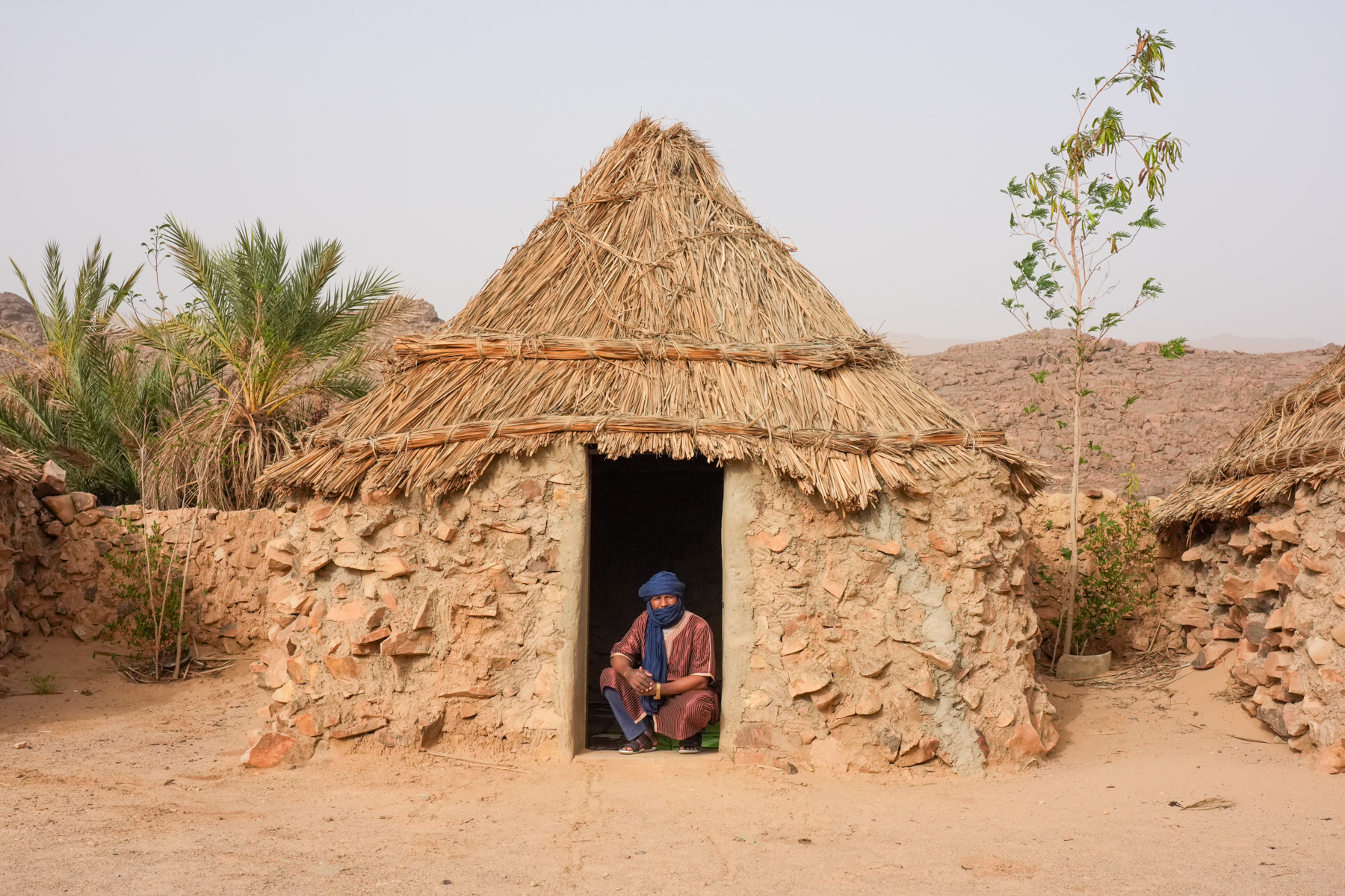 In the door of a traditional Tuareg stone house (image by Inger Vandyke)