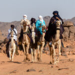 Tuareg men arrive for a camel dance (image by Inger Vandyke)