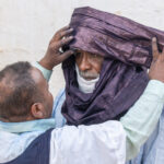 Dressing an elder (image by Inger Vandyke)