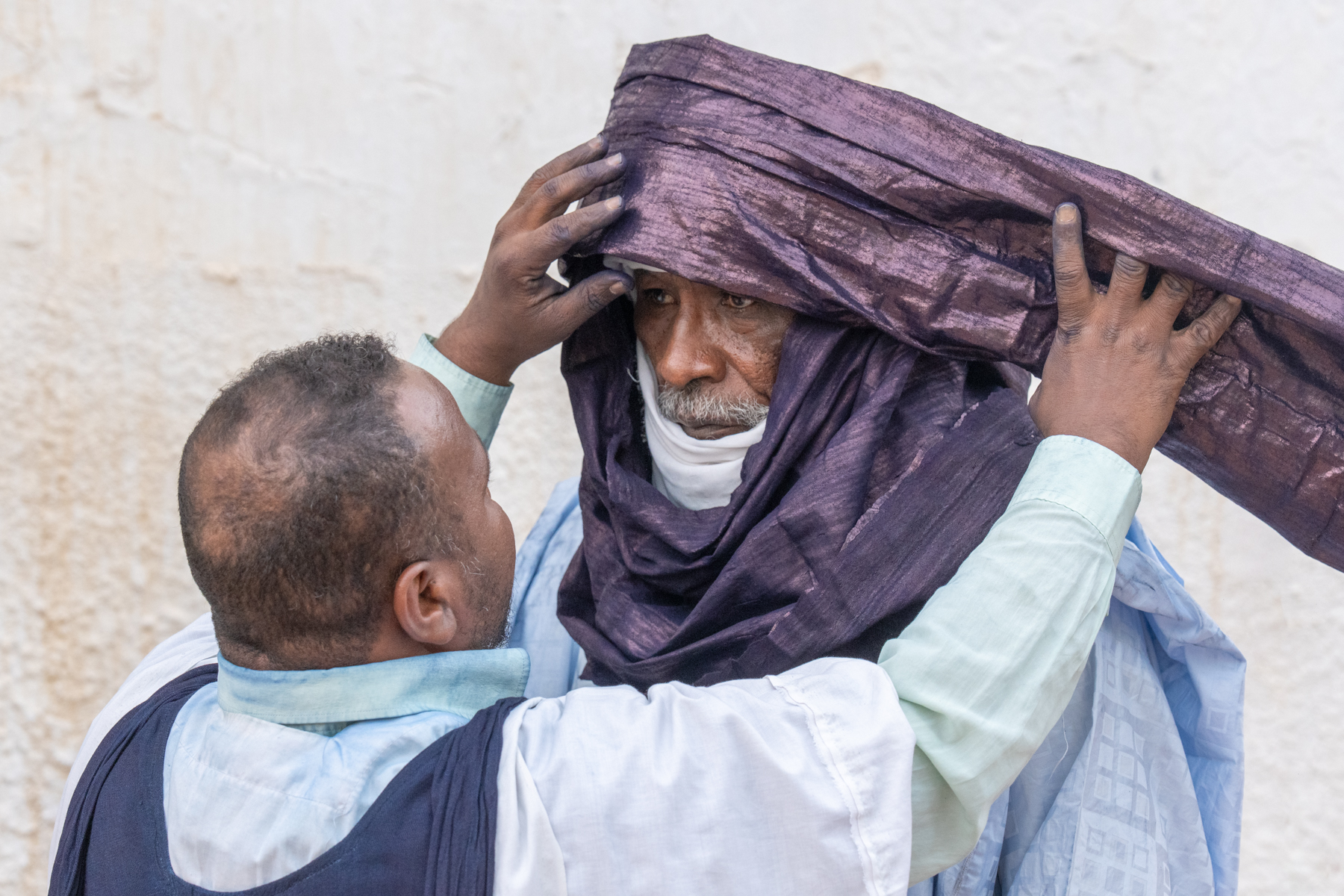 Dressing an elder (image by Inger Vandyke)