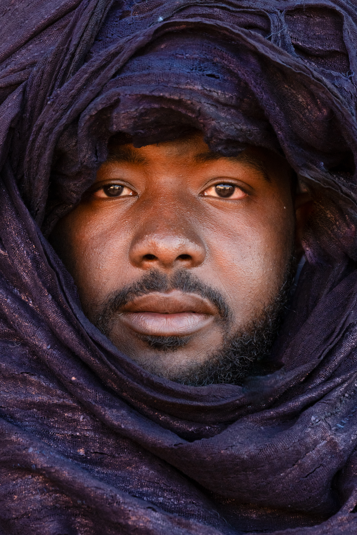 Tuareg man wrapped in indigo (image by Inger Vandyke)