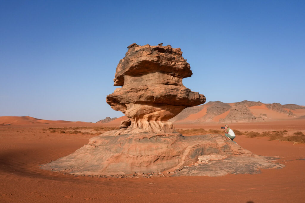 Sabine photographing one of Tadrart's most beautiful pillars (image by Inger Vandyke)