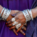 The hands of a Tuareg girl, adorned with silver, indigo and henna (image by Inger Vandyke)