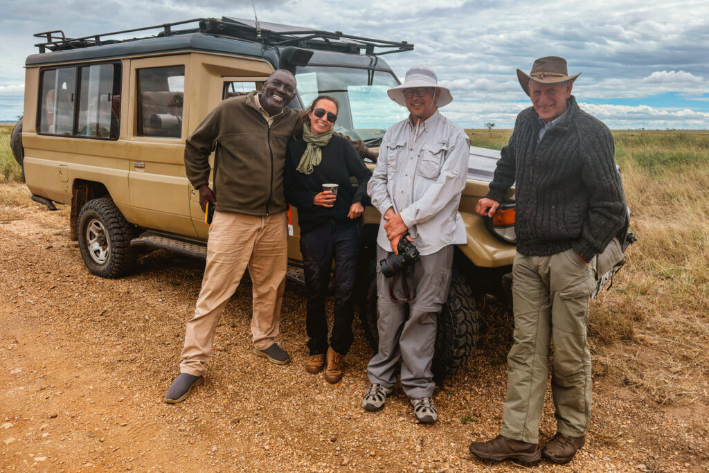 Tour members enjoy a coffee break in the Ngorongoro Crater, with our brilliant driver/co-guide Exaud (image by Virginia Wilde)