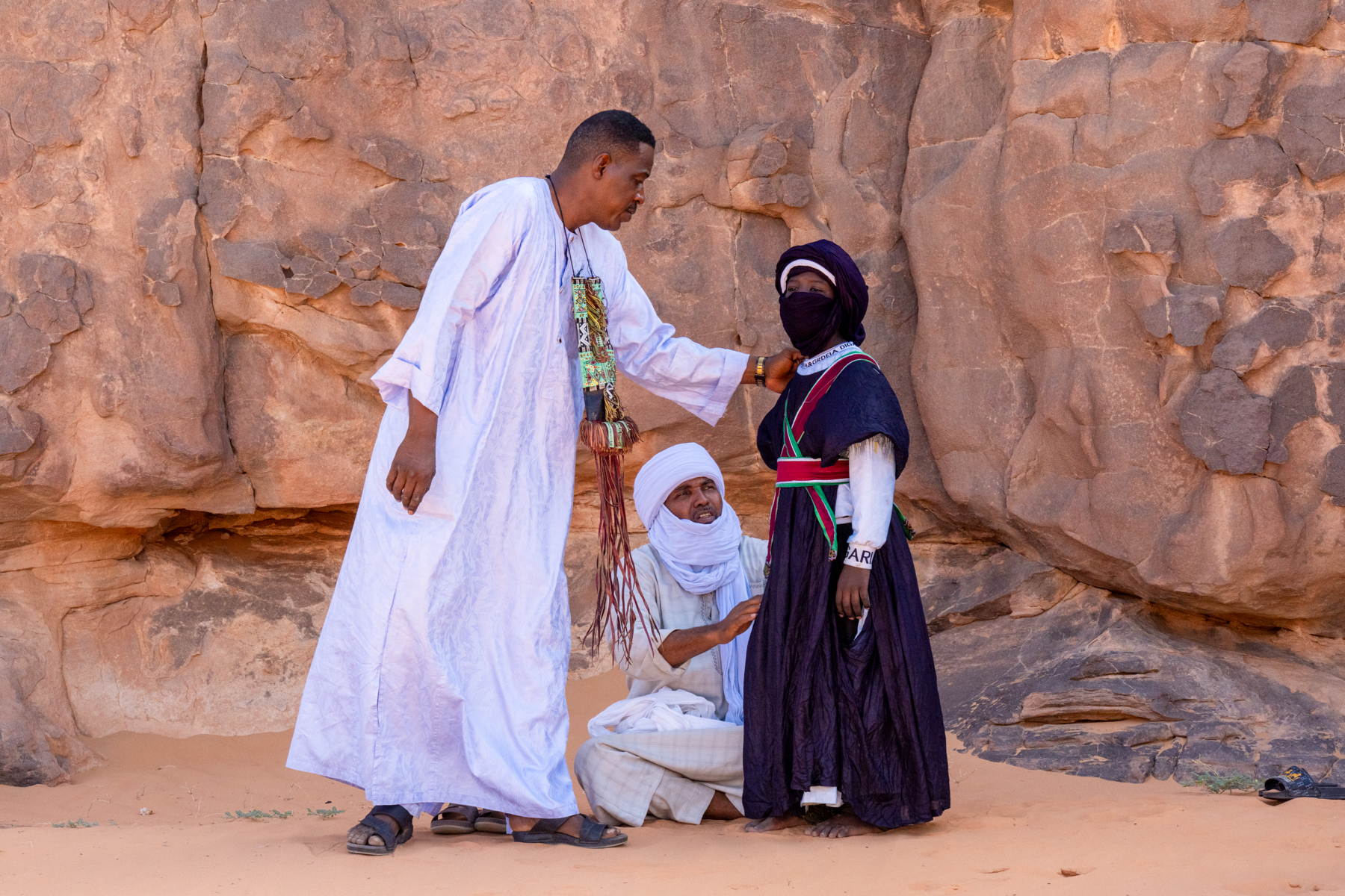 Men prepare a young Tuareg boy for a ceremony of Tahamat (image by Inger Vandyke)