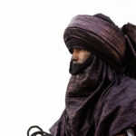 Side portrait of Tuareg man with indigo tagelmust (image by Inger Vandyke)