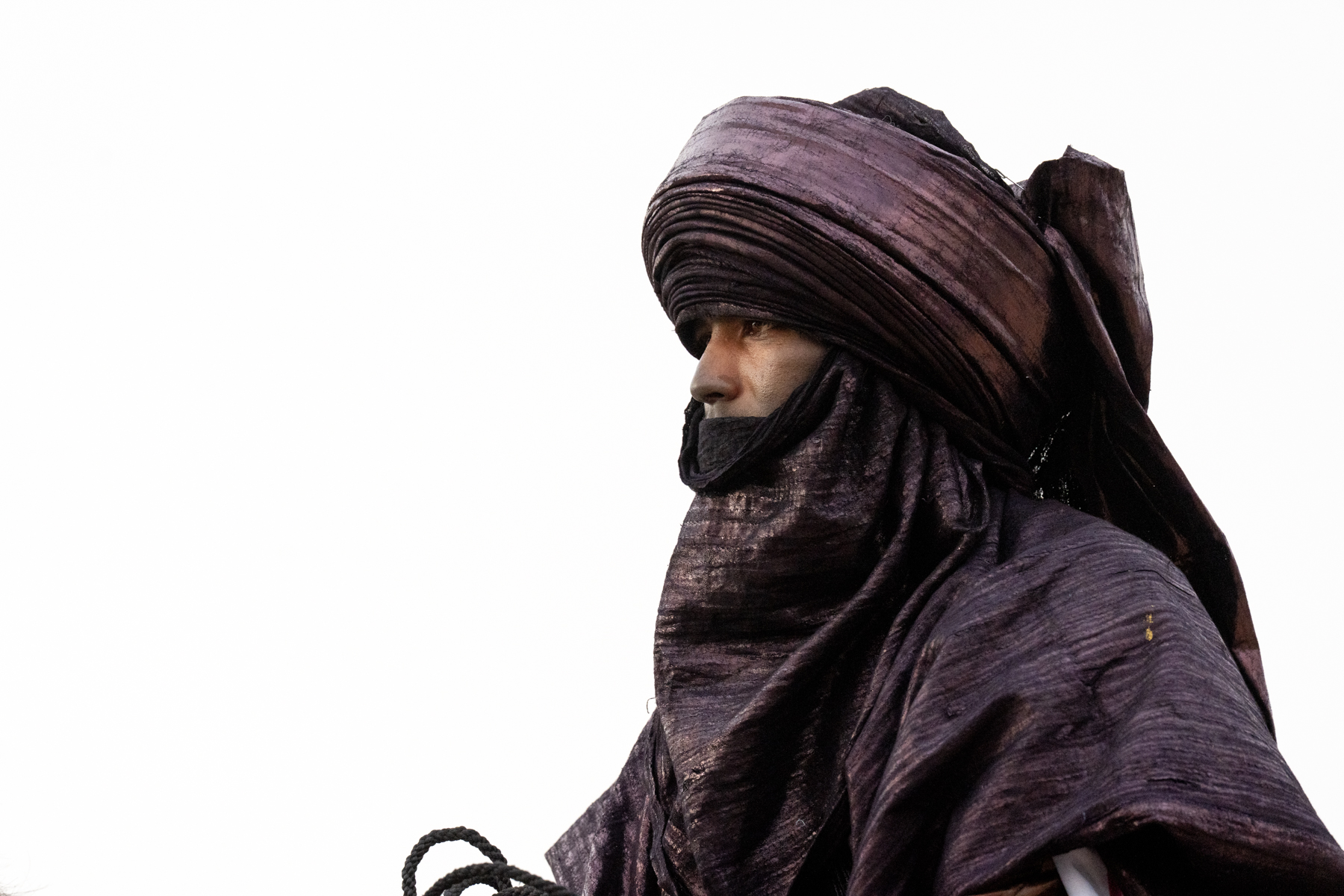 Side portrait of Tuareg man with indigo tagelmust (image by Inger Vandyke)