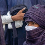 Wrapped in indigo at the preparation session for Al Mirhan warriors in Sebiba (image by Inger Vandyke)