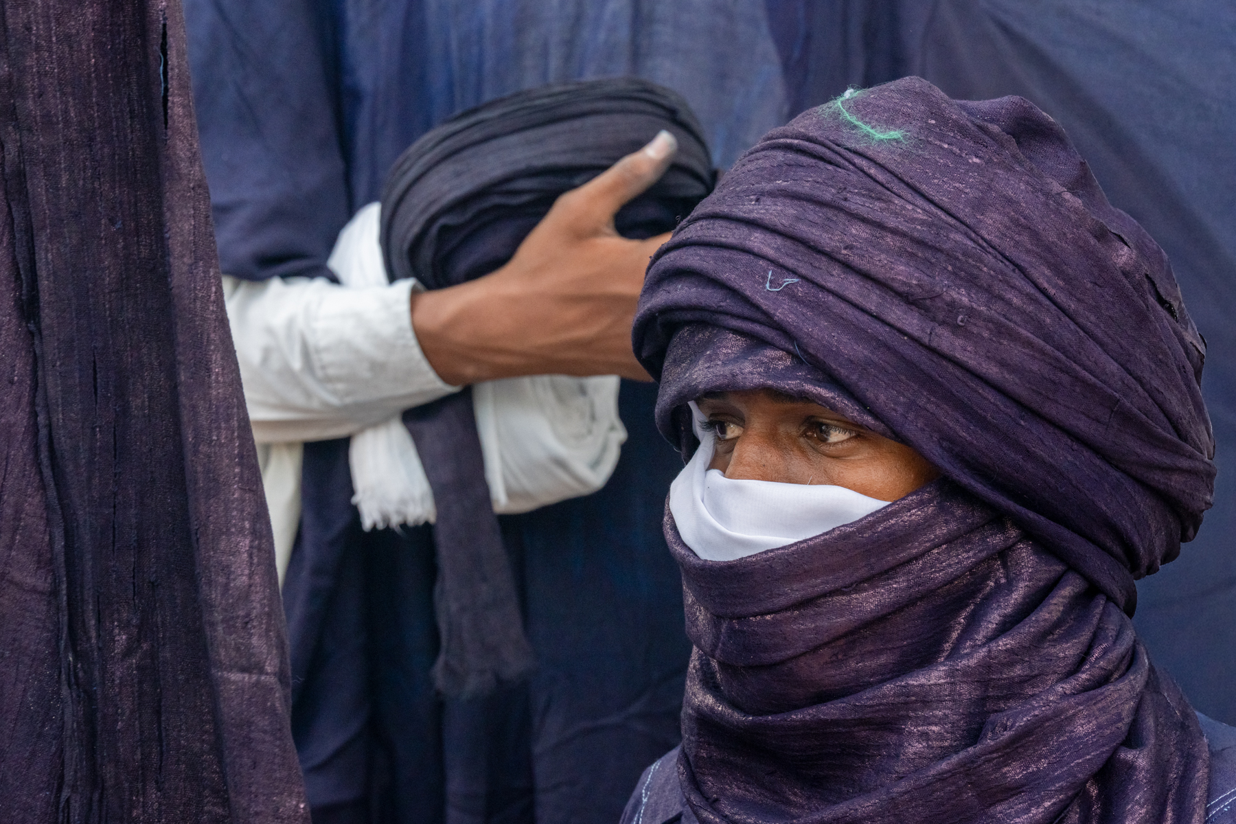 Wrapped in indigo at the preparation session for Al Mirhan warriors in Sebiba (image by Inger Vandyke)