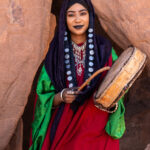 Beautiful Tuareg girl with Tinde drum at a ceremony of Tahamat in the desert (image by Inger Vandyke)
