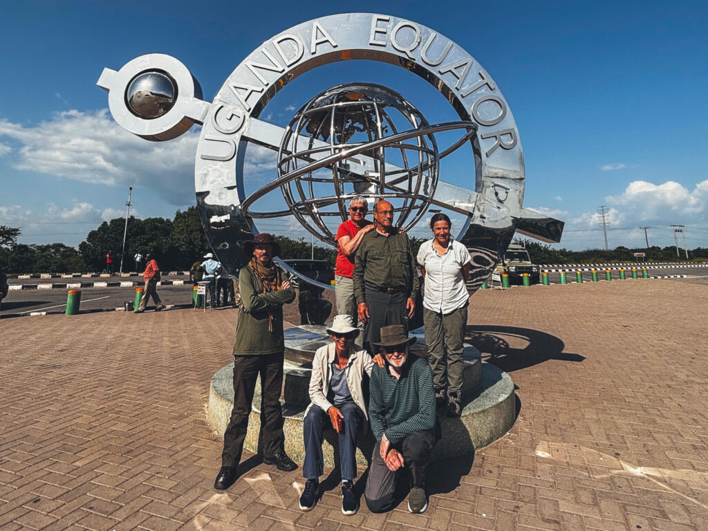 This year's brilliant Uganda tour members at the official Equator line (image by Virginia Wilde)