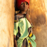 A beautiful young Gabbra girl in the doorway of her home (image by Inger Vandyke)
