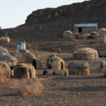 A village of El Molo people. All of these houses have been moved to higher ground in the past few years due to rising lake waters in Turkana (image by Inger Vandyke)