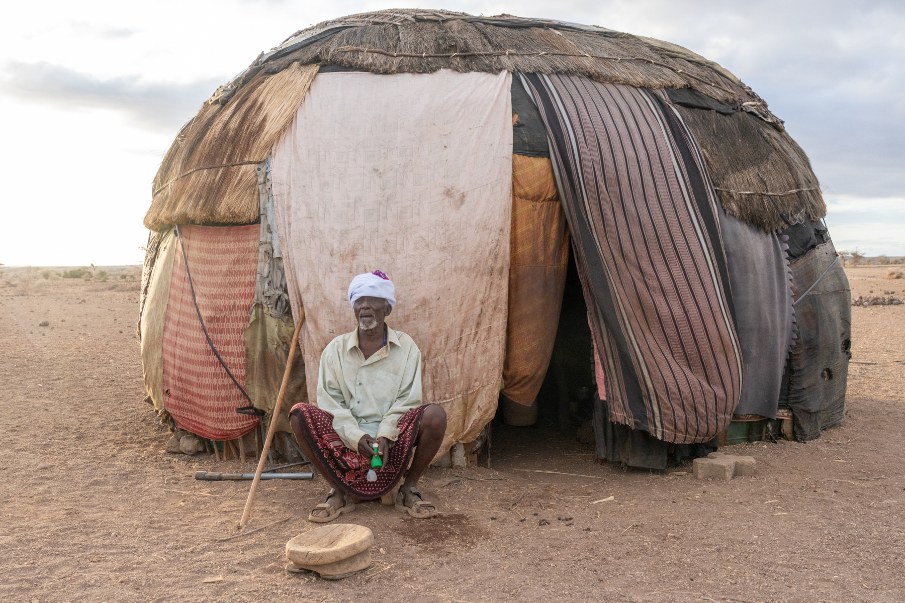 An elderly Gabbra man outside his home (image by Inger Vandyke)