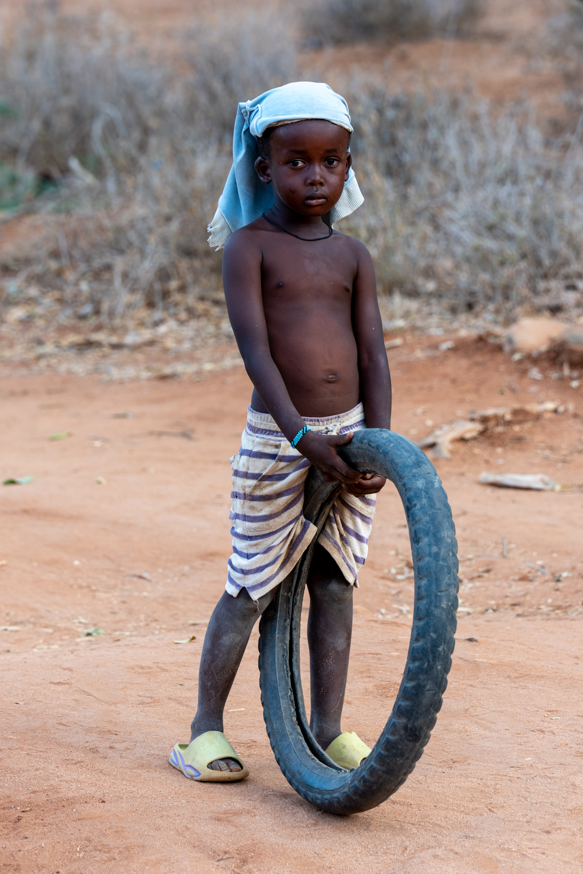 Young Rendille child with his tyre toy (image by Inger Vandyke)