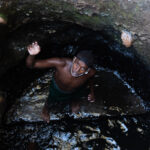 Young Rendille man at the bottom of a singing well (image by Inger Vandyke)