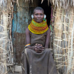 A Turkana woman in the doorway of her home (image by Inger Vandyke)