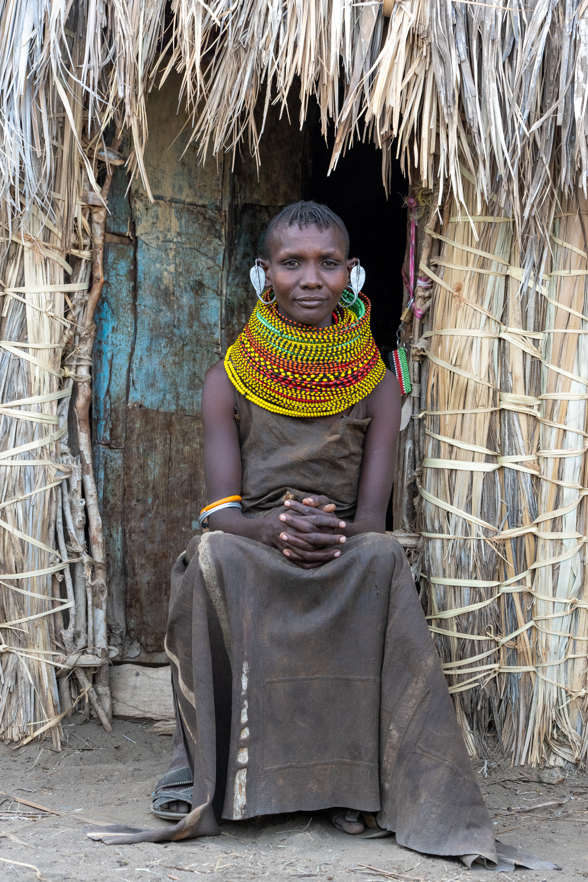 A Turkana woman in the doorway of her home (image by Inger Vandyke)