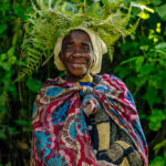 An Echuya Twa woman beams after showing us some traditional crafts in Uganda (image by Virginia Wilde)