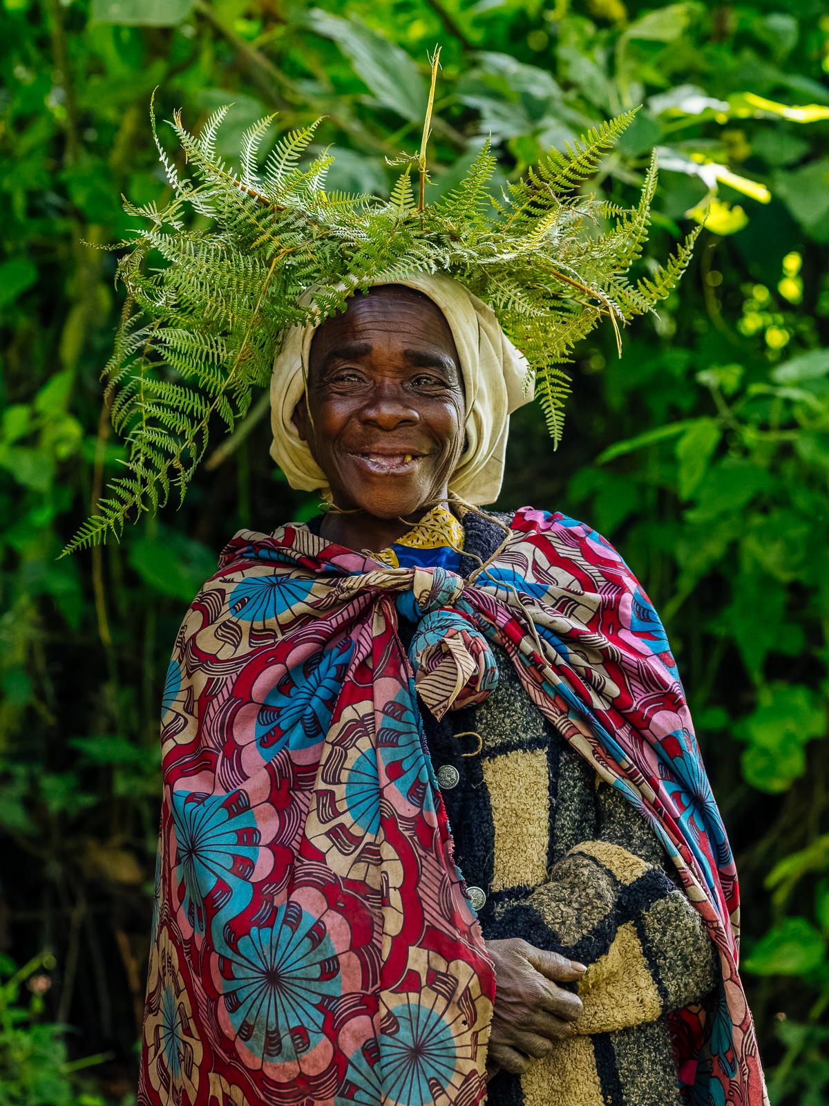 An Echuya Twa woman beams after showing us some traditional crafts in Uganda (image by Virginia Wilde)