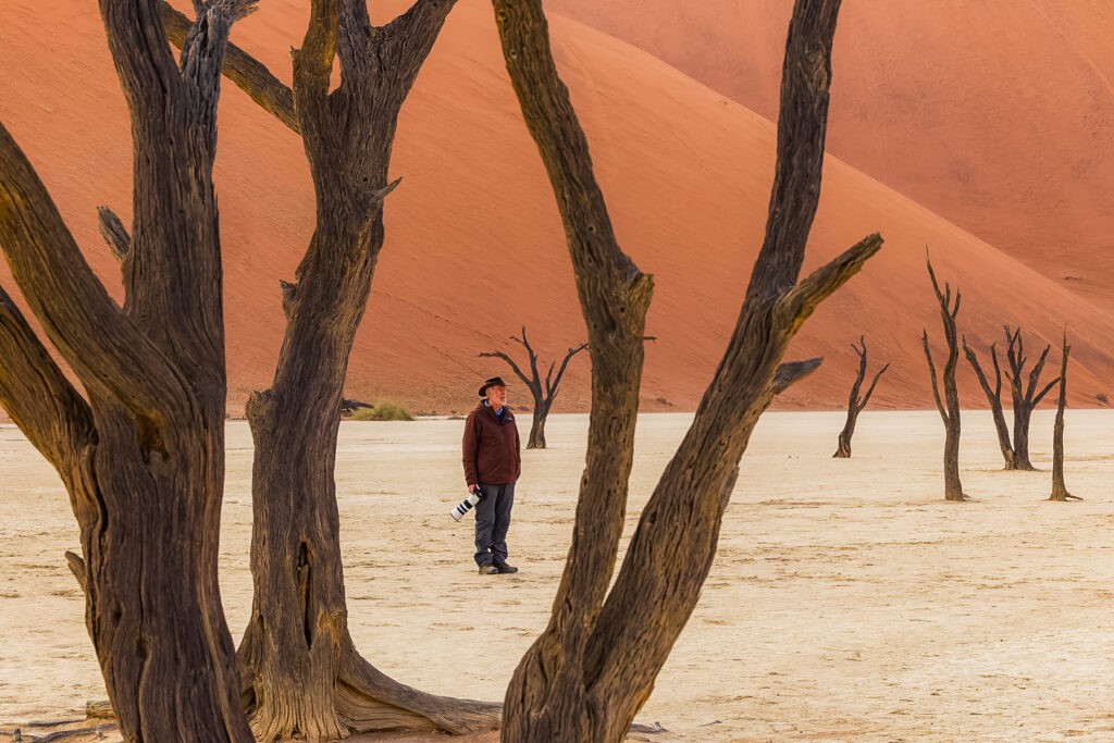 One of the toughest photographic challenges in Deadvlei is finding a composition you like between all the ancient Camel Thorn trees. Here, client Mike ponders his options (image by Virginia Wilde)